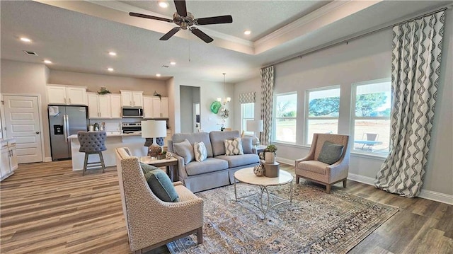2295 Nadine Ln, Mobile, AL 36695 - living area with wood finished floors, ceiling fan, recessed lighting, crown molding, and a textured ceiling