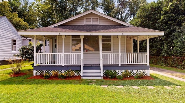 21 Crenshaw St, Mobile, AL 36606 - country-style home featuring covered porch and a shingled roof