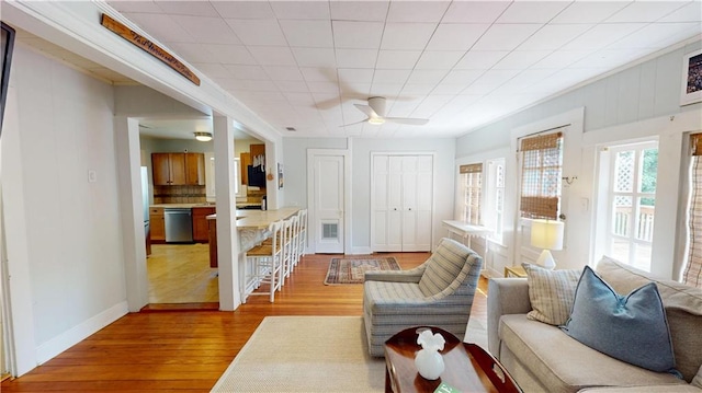 21 Crenshaw St, Mobile, AL 36606 - living area with wood finished floors, a ceiling fan, and baseboards