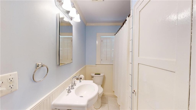 21 Crenshaw St, Mobile, AL 36606 - bathroom featuring toilet, ornamental molding, a wainscoted wall, a sink, and tile patterned flooring