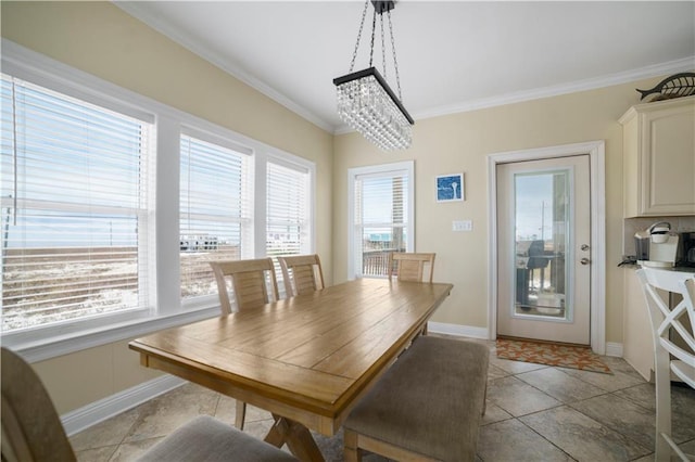 dining space featuring ornamental molding, light tile patterned flooring, plenty of natural light, and baseboards