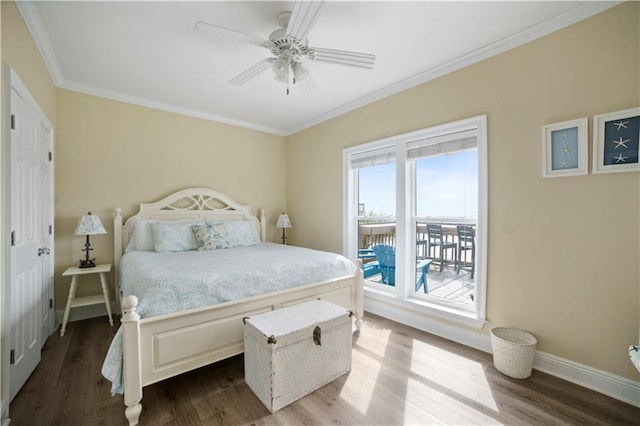 bedroom featuring ceiling fan, baseboards, dark wood-style flooring, and ornamental molding