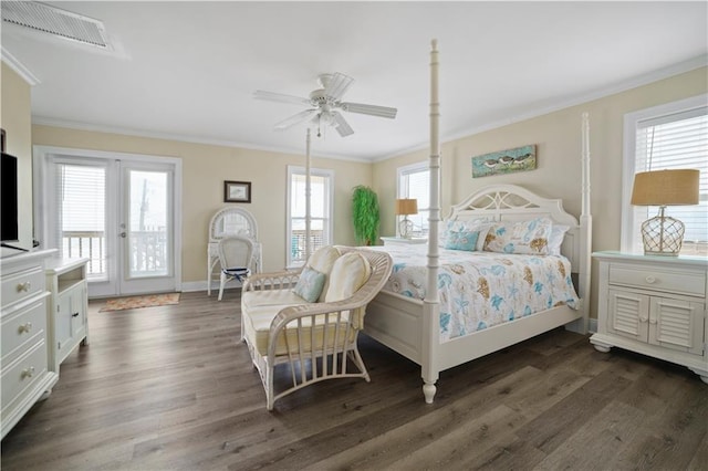 bedroom featuring visible vents, dark wood finished floors, and crown molding