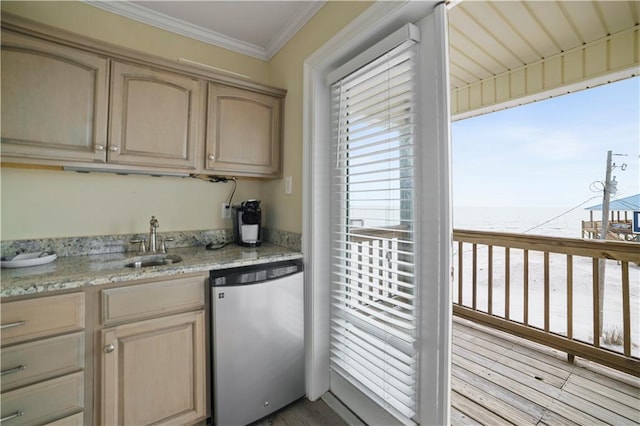 kitchen featuring dishwasher, light stone countertops, crown molding, light brown cabinets, and a sink