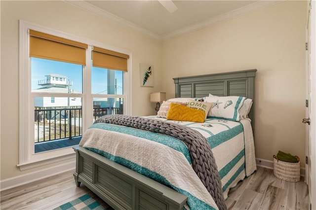 bedroom featuring ceiling fan, baseboards, ornamental molding, and light wood finished floors