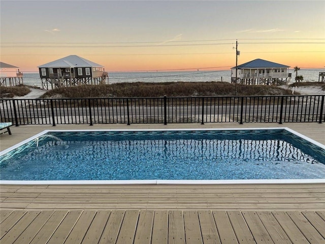 view of swimming pool with a fenced in pool and fence