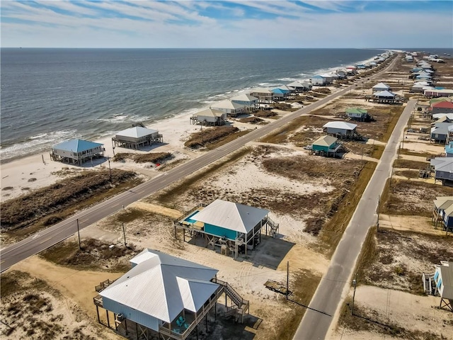 birds eye view of property with a view of the beach and a water view