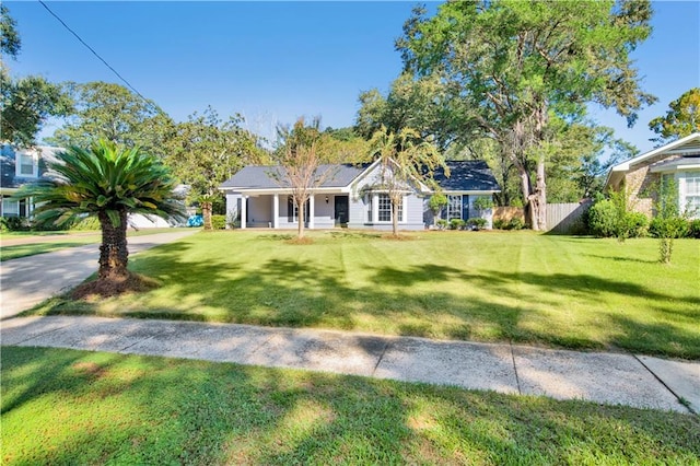 ranch-style house featuring a front lawn