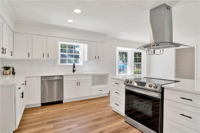 kitchen featuring island exhaust hood, appliances with stainless steel finishes, and white cabinets