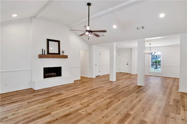 5912 Cansler Dr, Mobile, AL 36609 - unfurnished living room with a ceiling fan, a fireplace, light wood finished floors, a chandelier, and baseboards