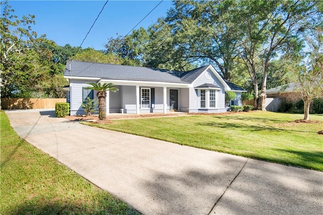 single story home with a porch and a front lawn