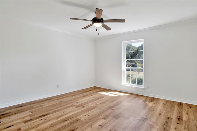 spare room with ceiling fan, crown molding, light hardwood / wood-style floors, and a healthy amount of sunlight