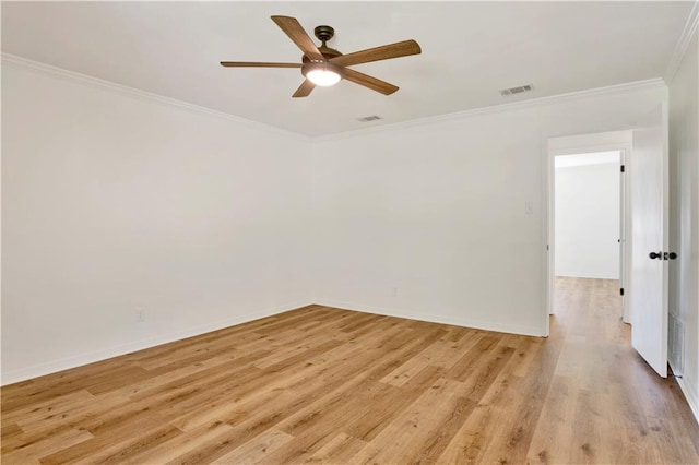 empty room featuring crown molding, ceiling fan, and light hardwood / wood-style floors