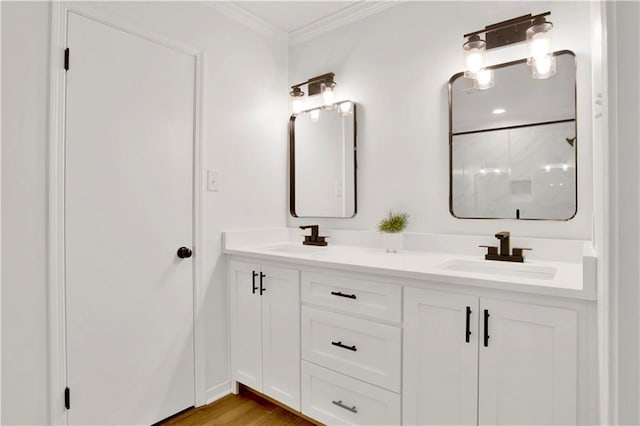 5912 Cansler Dr, Mobile, AL 36609 - bathroom with crown molding, double vanity, a shower, and wood finished floors