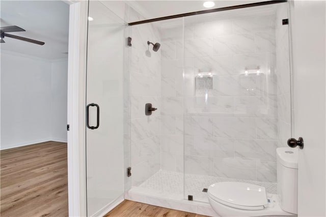 5912 Cansler Dr, Mobile, AL 36609 - full bathroom featuring toilet, ceiling fan, crown molding, a stall shower, and wood finished floors