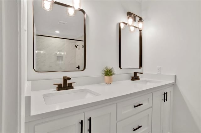 5912 Cansler Dr, Mobile, AL 36609 - full bathroom featuring double vanity and a tile shower