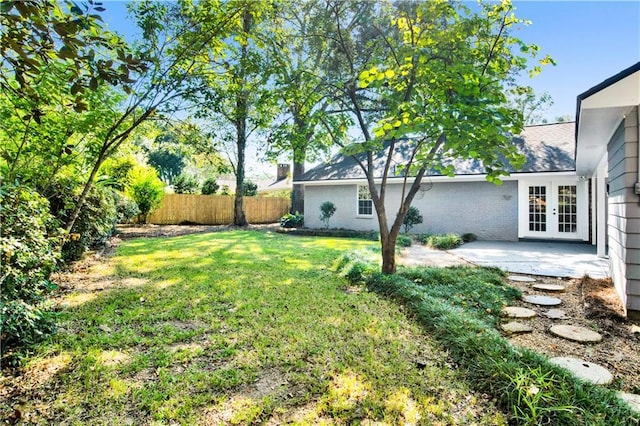 5912 Cansler Dr, Mobile, AL 36609 - view of yard featuring french doors and a patio area