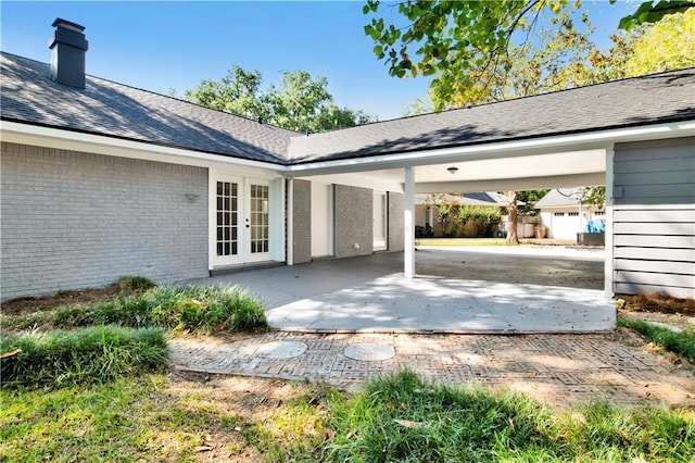 5912 Cansler Dr, Mobile, AL 36609 - view of patio with french doors and a carport