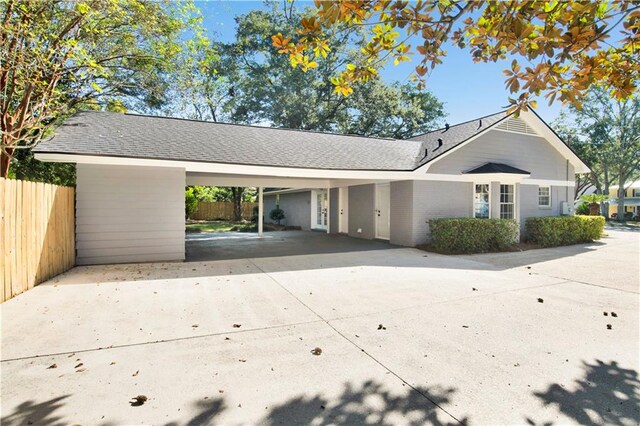 exterior space featuring a carport