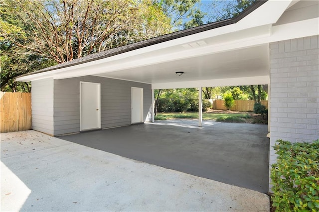 5912 Cansler Dr, Mobile, AL 36609 - view of parking / parking lot featuring an attached carport and driveway