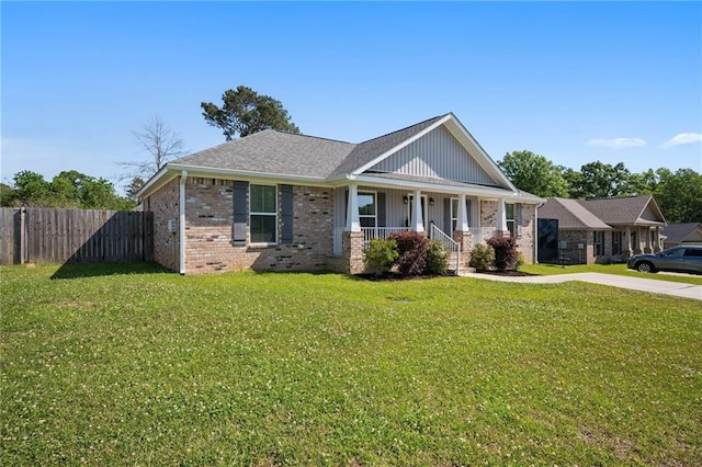 9412 Fox Hunter Ct, Semmes, AL 36575 - view of front of property featuring a porch, a front lawn, fence, and brick siding