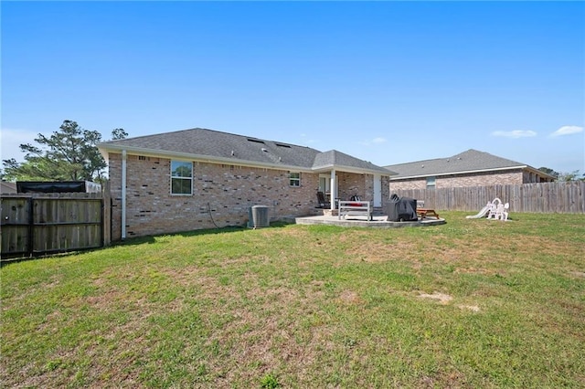 9412 Fox Hunter Ct, Semmes, AL 36575 - rear view of house featuring a fenced backyard, brick siding, a yard, and a patio