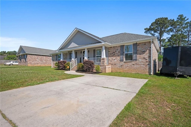 9412 Fox Hunter Ct, Semmes, AL 36575 - view of front of property featuring brick siding, a porch, and a front yard