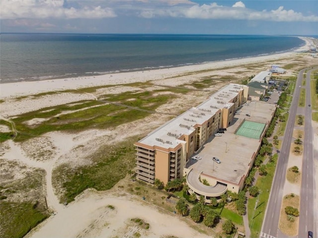 drone / aerial view with a water view and a view of the beach