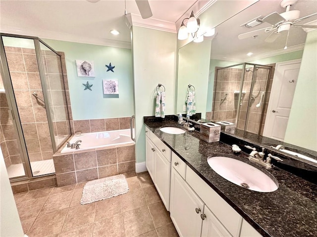 bathroom with tile patterned floors, vanity, ornamental molding, and shower with separate bathtub