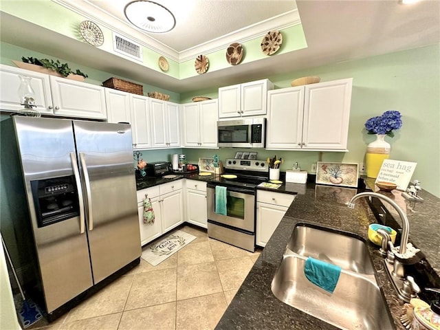 kitchen featuring white cabinetry, sink, crown molding, and appliances with stainless steel finishes