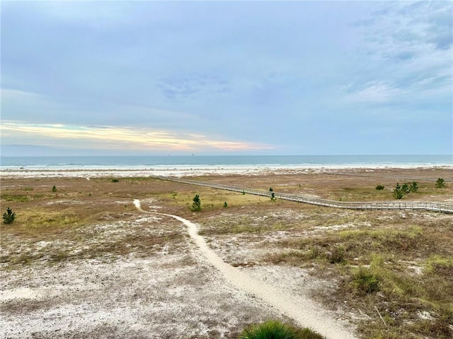 property view of water featuring a beach view