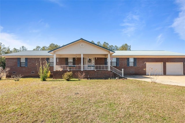 single story home featuring a front lawn, covered porch, and a garage