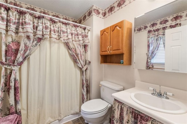 bathroom featuring vanity, a shower with shower curtain, a textured ceiling, and toilet