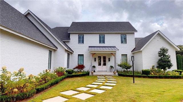 140E Mcgregor Ave S, Mobile, AL 36608 - view of front facade with brick siding and a front lawn