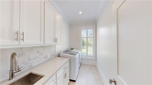 140E Mcgregor Ave S, Mobile, AL 36608 - laundry room with cabinet space, washer and clothes dryer, light tile patterned floors, baseboards, and recessed lighting