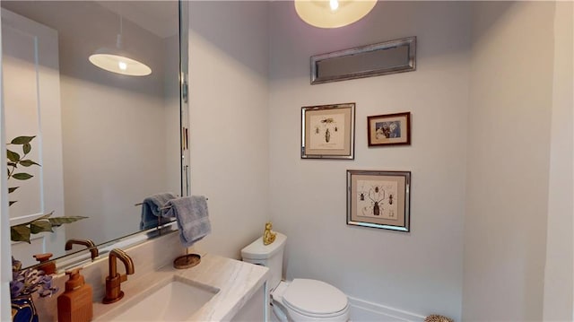 140E Mcgregor Ave S, Mobile, AL 36608 - bathroom featuring toilet and vanity