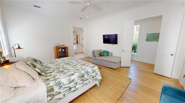 140E Mcgregor Ave S, Mobile, AL 36608 - bedroom with light wood-type flooring, crown molding, baseboards, ensuite bath, and a ceiling fan