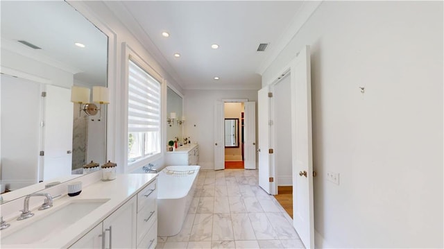 140E Mcgregor Ave S, Mobile, AL 36608 - bathroom with recessed lighting, marble look tiles, a freestanding bath, vanity, and ornamental molding