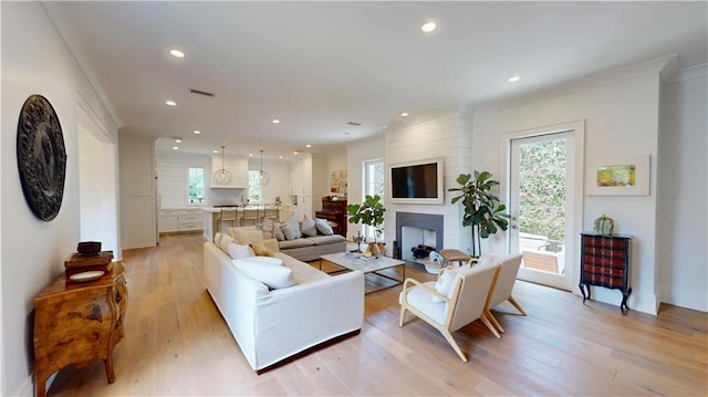 140E Mcgregor Ave S, Mobile, AL 36608 - living room with plenty of natural light, light wood-style floors, recessed lighting, a fireplace, and ornamental molding
