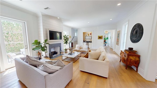 140E Mcgregor Ave S, Mobile, AL 36608 - living room with plenty of natural light, a fireplace, light wood-style flooring, recessed lighting, and ornamental molding