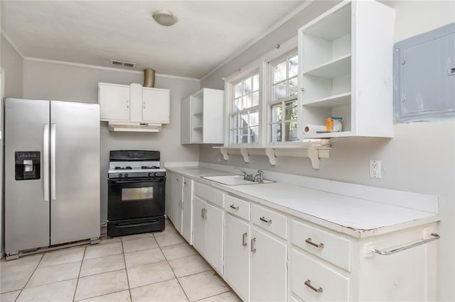 kitchen with open shelves, gas stove, a sink, stainless steel fridge, and electric panel