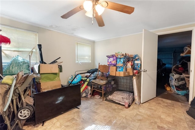 misc room featuring crown molding and ceiling fan