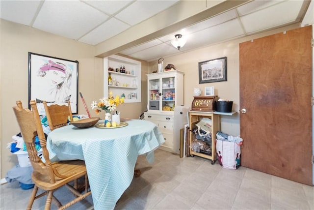 dining room with a paneled ceiling