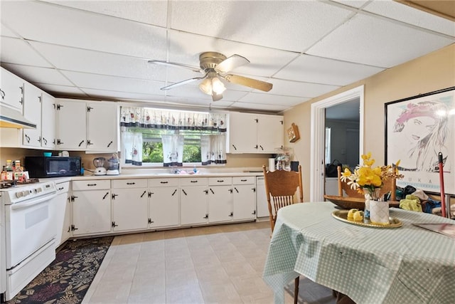 kitchen with ceiling fan, white cabinetry, ventilation hood, a drop ceiling, and white range