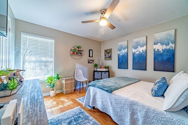 4698 Clarendon Dr, Mobile, AL 36619 - bedroom featuring ceiling fan, wood finished floors, and baseboards