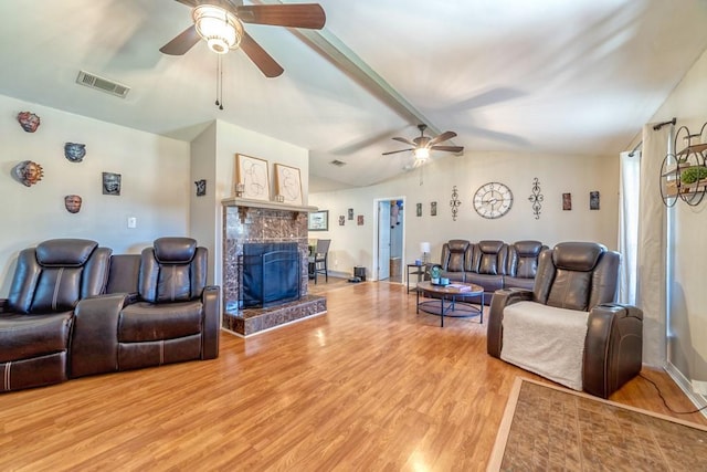 4698 Clarendon Dr, Mobile, AL 36619 - living area with visible vents, a ceiling fan, vaulted ceiling with beams, light wood-style floors, and a fireplace