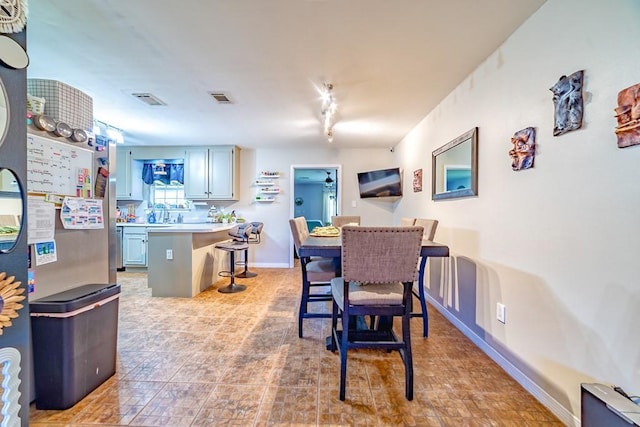 4698 Clarendon Dr, Mobile, AL 36619 - dining room with baseboards, visible vents, and track lighting