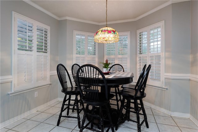 dining space with ornamental molding, a chandelier, and light tile patterned floors