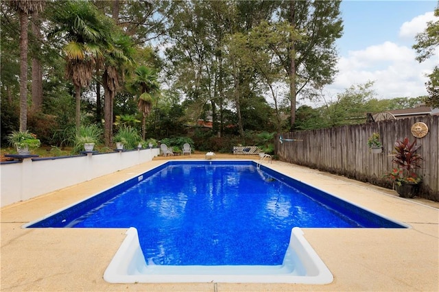 view of swimming pool featuring a patio