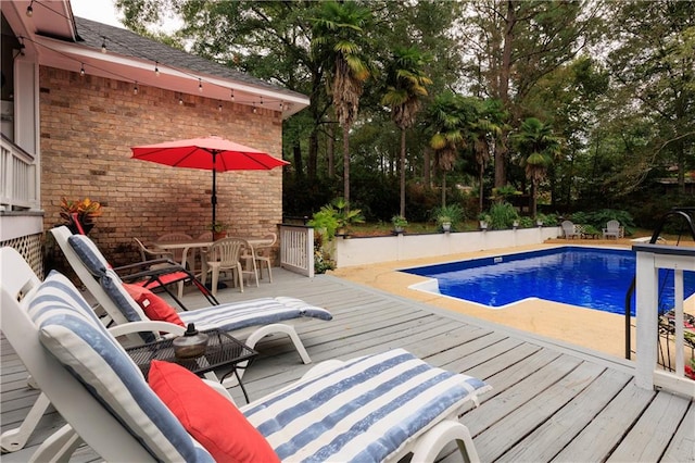 view of pool featuring a wooden deck